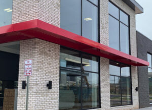 Why a New Awning Can Help Improve Curb Appeal For Your Business